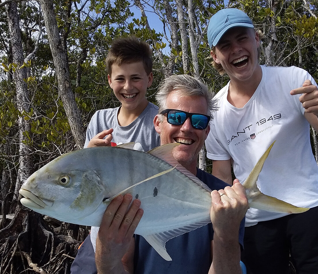Father and sons fishing on the Daintree River